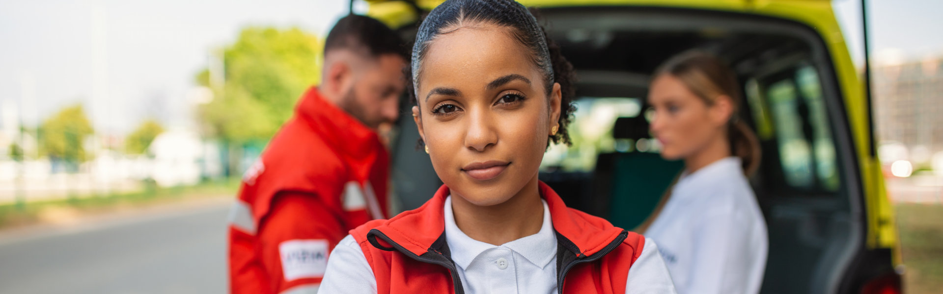 female paramedic smiling and looking at the camera